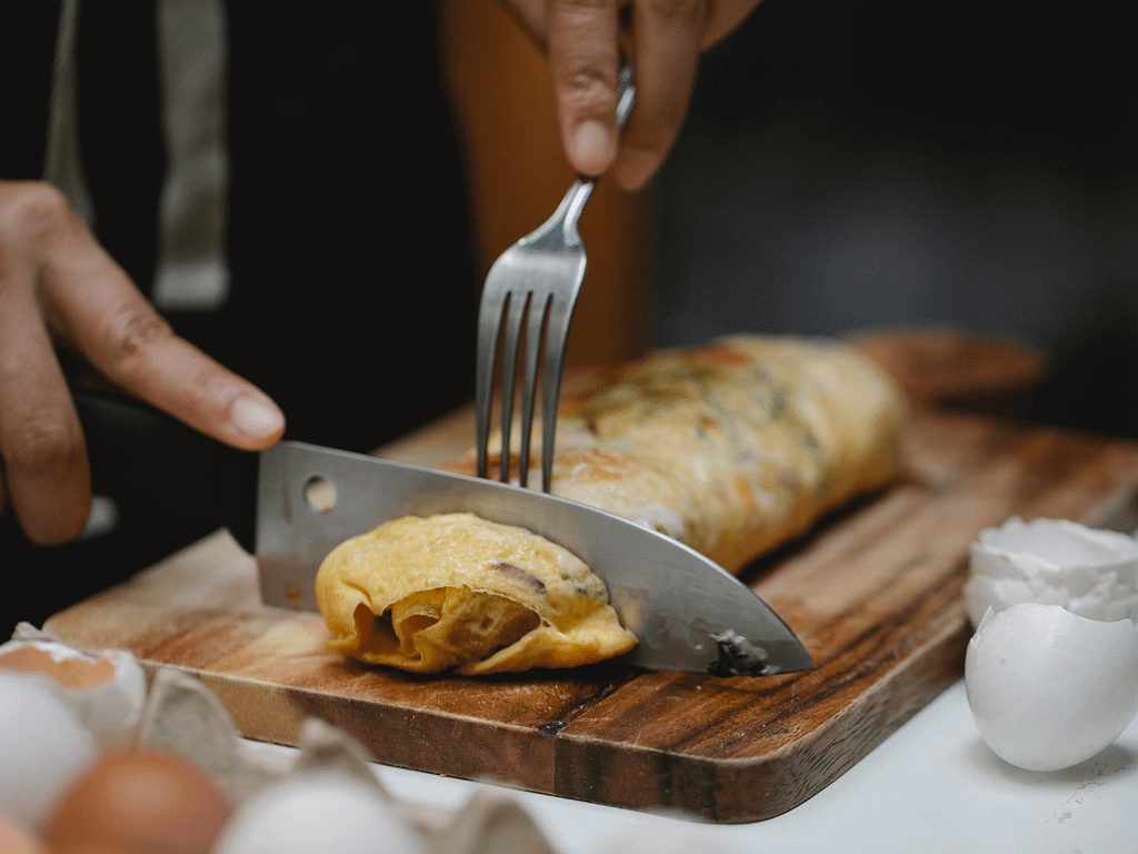egg roll on a wooden tray